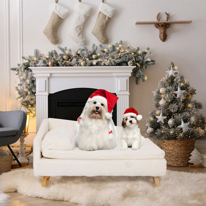 White dog relaxing on an elevated dog bed beside a decorated Christmas tree