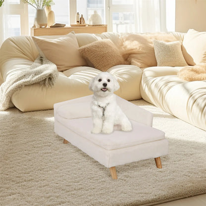 Cream elevated dog bed with wooden legs and padded sofa-style design in a living room